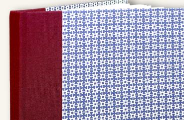 Burgundy blue notebook with pointed star papeterie Schreibweise